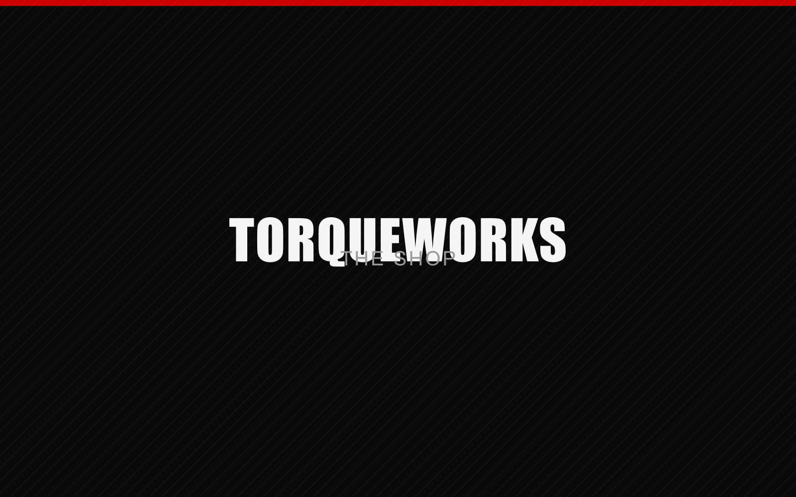 Torqueworks Automotive technician working on an engine